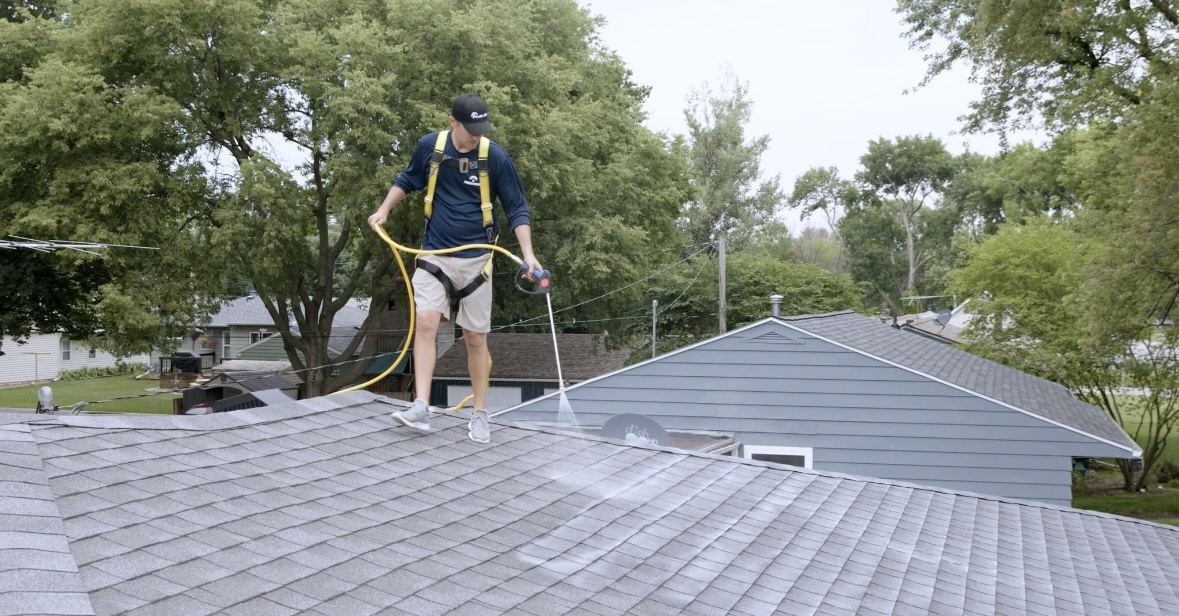 Roof restoration treatment being applied to an asphalt shingle roof near Alpine, Utah