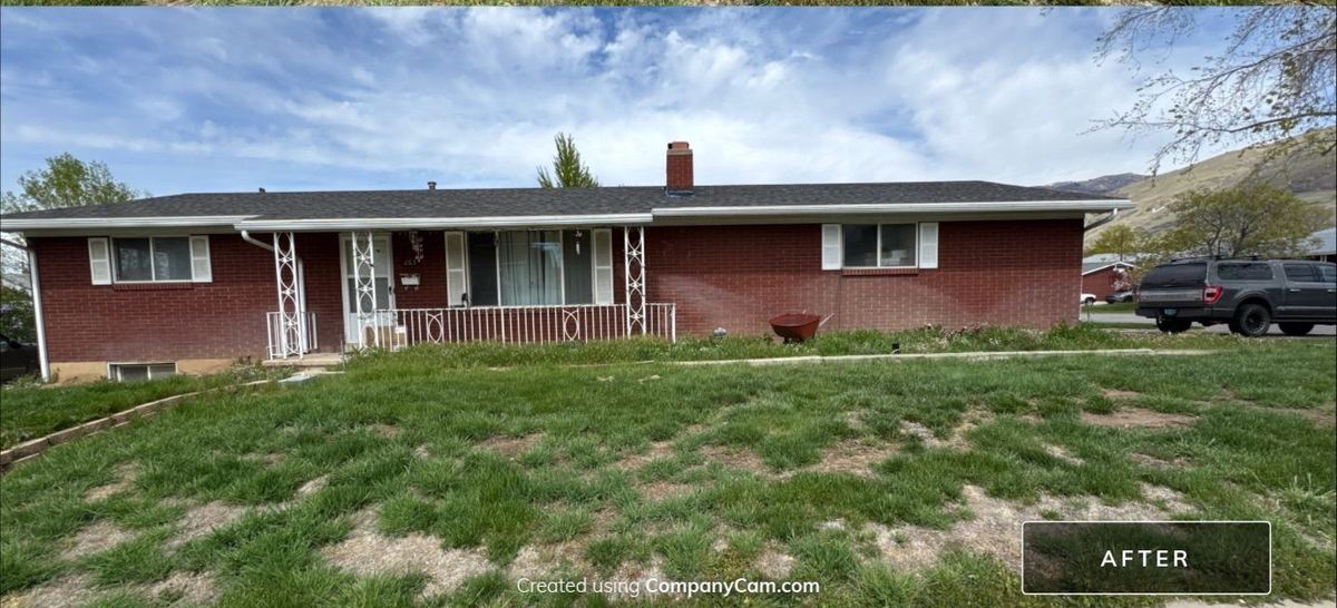 The same Utah roof after restoration: Full front elevation, brick ranch