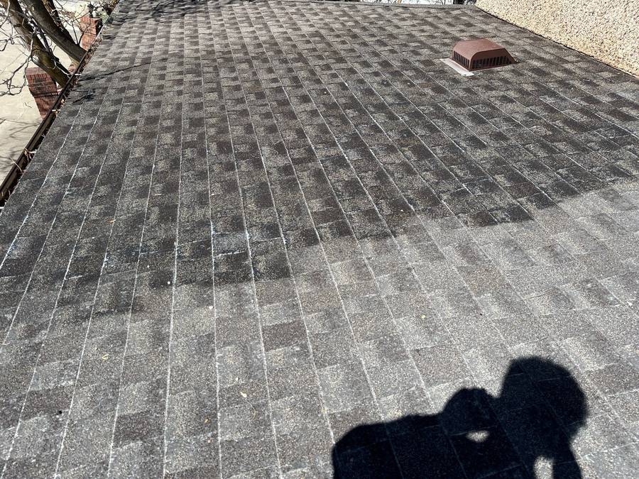 Close-up of worn grey asphalt shingles with granule loss on a Utah roof