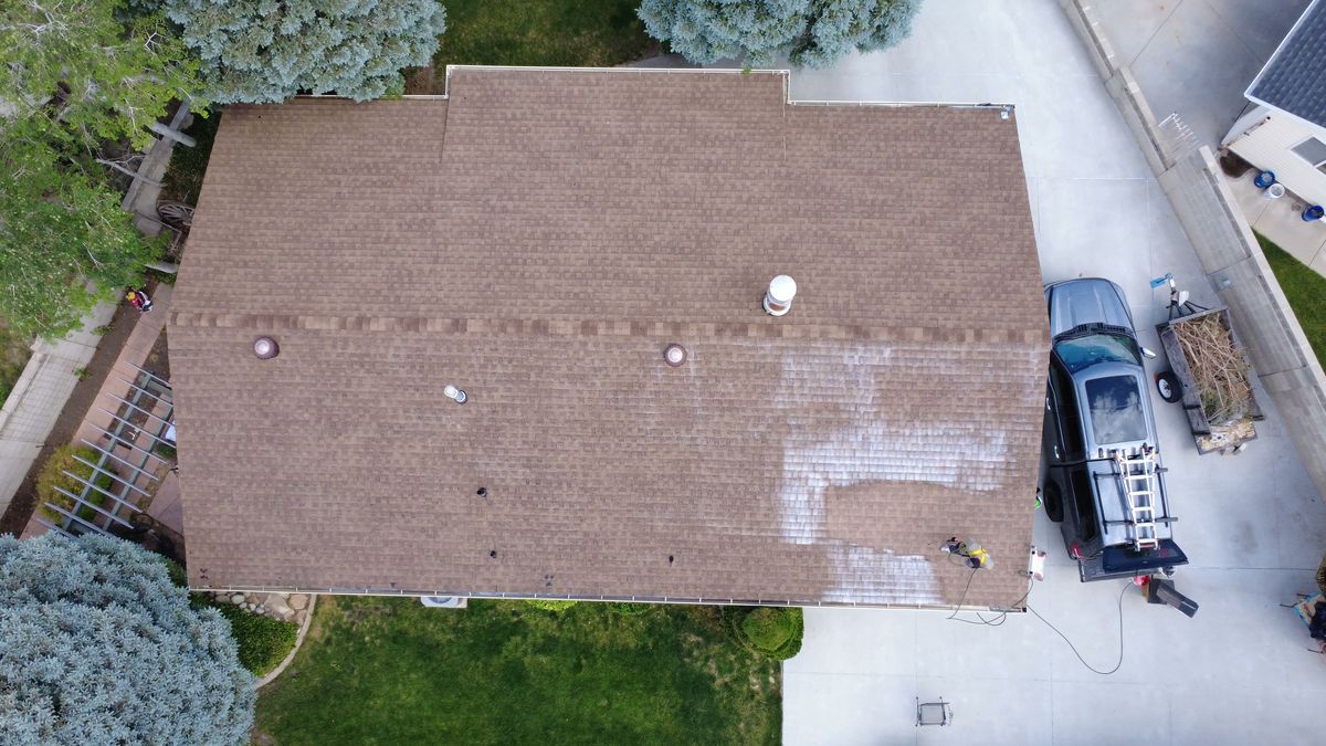 Utah roof part way through treatment, restored section darker than the dried out shingles