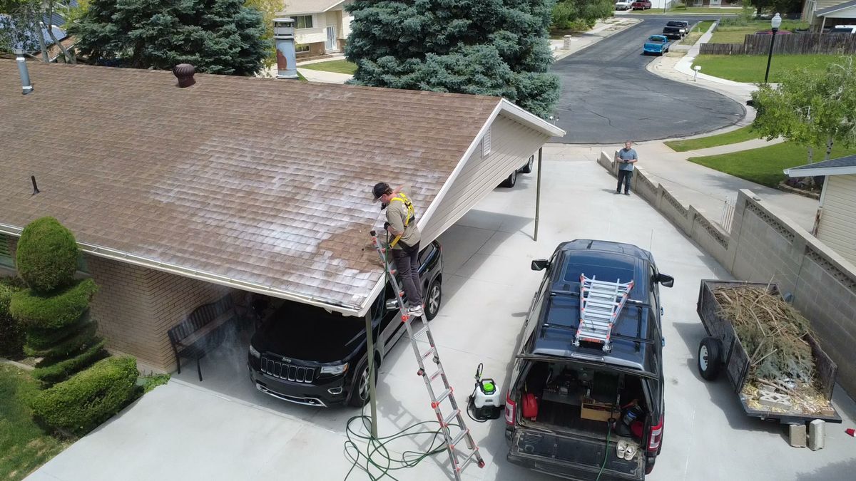 The Revive Your Roof van and ladder set up in a Utah driveway
