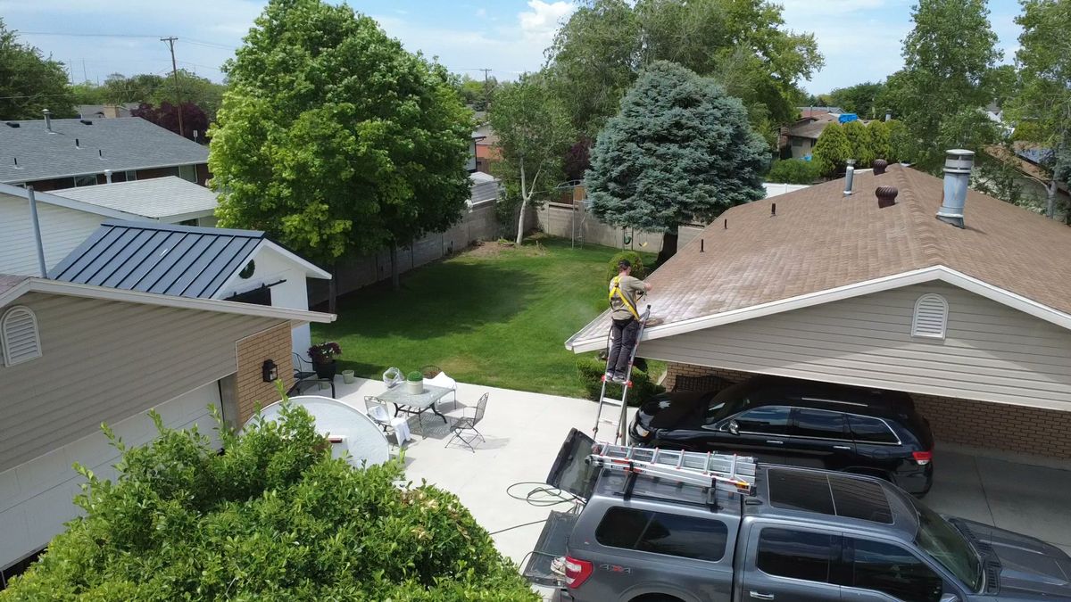 Revive Your Roof van and ladder set up at the eave of a Utah home
