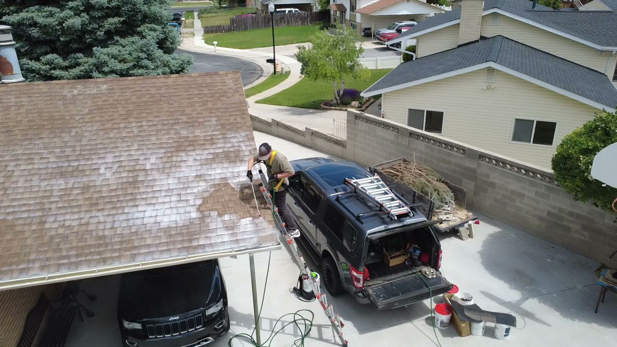 Revive Your Roof van and ladder arriving at a Utah home
