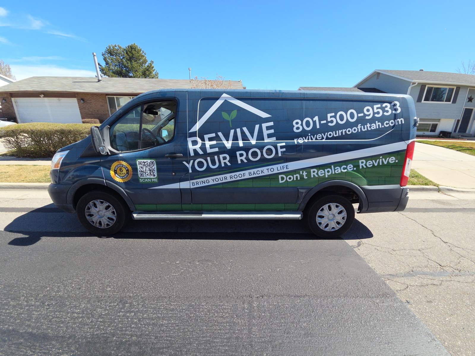 Revive Your Roof branded van parked on a residential street in Utah with the phone number on the side